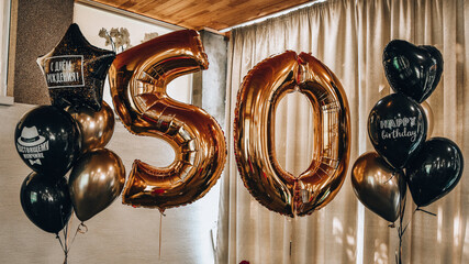 Gold inflatable balls in the form of a figure 50, Birthday anniversary party. Gold 50th Birthday...
