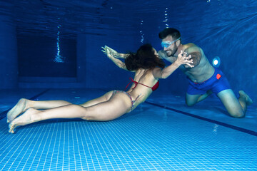 Couple in love underwater fun