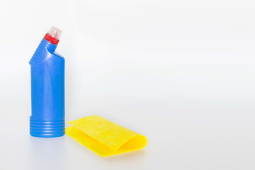 Plastic bottles with chemicals for home cleaning on a white background.