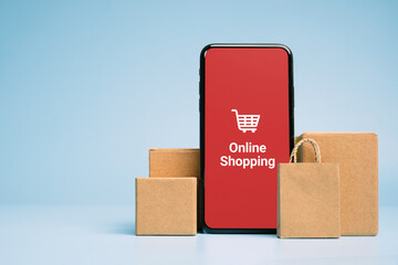Concept online Sopping. boxes and shopping bag with Smartphone Online Shopping screen.