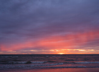 Naklejka na ściany i meble colorful sunset on beach of normandy in france