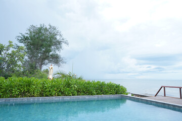 Swimming pool and surrounding garden and terrace.