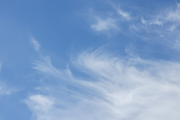 blue sky background with tiny clouds.