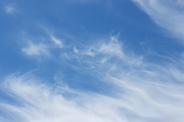 blue sky background with tiny clouds.
