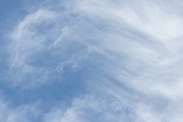 blue sky background with tiny clouds.