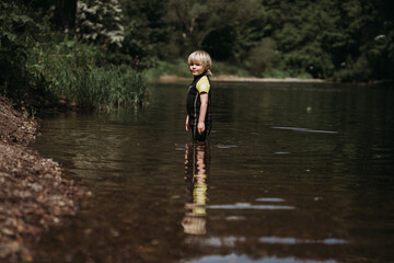 Fototapeta na wymiar Child in a lake