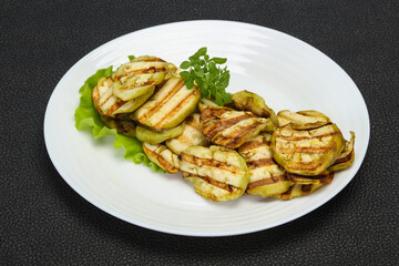 Grilled eggplant slices served basil