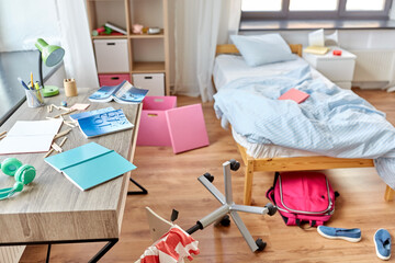 mess, disorder and interior concept - view of messy home kid's room with scattered stuff