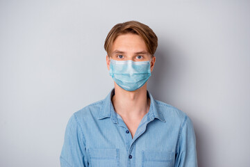 Close-up portrait of his he nice attractive blonde guy wear casual outfit safety mask stop flue...