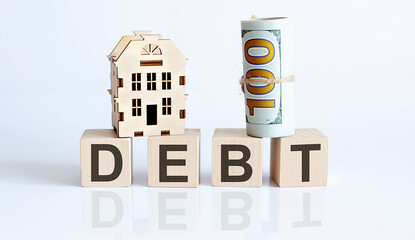 Wooden blocks with the word For DEBT Real estate concept. Rent apartment. Property.