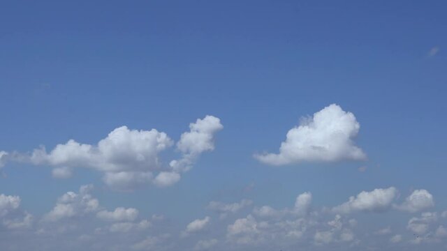 Cumulus and Stratified-Cumulus Clouds in the Blue Sky during the Day. Sky and Clouds 4k. Background of Sky and Clouds.