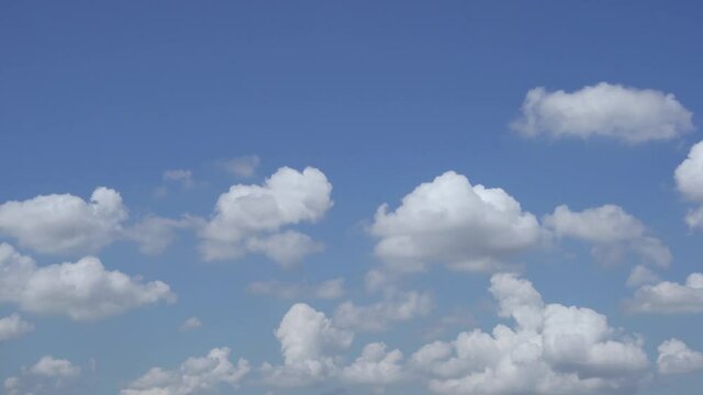 Plump White Clouds in a Blue Sky in the Afternoon in Cloudy Good Weather. Pure Nitrogen Layer. Background of Sky and Clouds.