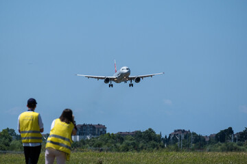 plane spotting at the airport of Sochi. A lot of people take photos of the plane. Hobby to watch the planes. Photographers airplane