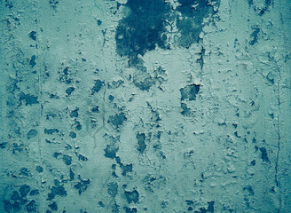 Old cracked paint on the concrete wall.