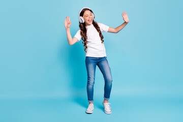 Full length body size view of nice dreamy cheerful wavy-haired girl listening stereo single melody...