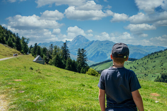 boy looking Pic du Midi de Bigorre in the french Pyrenees mountains