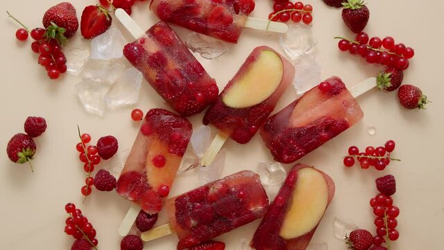 Homemade frozen various red berries natural juice popsicles - paletas - ice pops