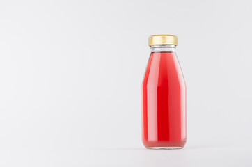 Pink strawberry juice in glass bottle with gold cap mock up on white background with copy space, template for packaging, advertising, design product, branding.