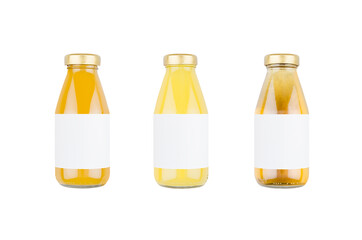 Summer fruits juices - orange juice, mango, apple in glass bottles with blank label isolated, mock up for design, advertising, branding product.
