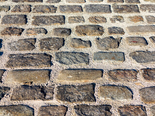 Urban stone paving stones. Texture, background, selective focus