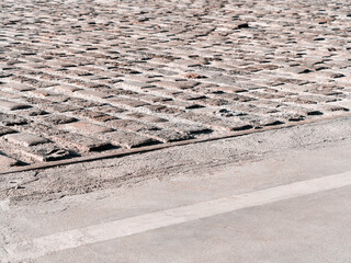 Urban stone paving stones. Texture, background, selective focus