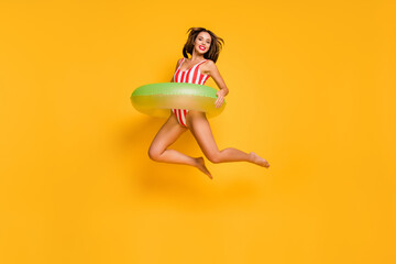 Full length photo of beautiful lady slim bronze body beach pool jumping high up into water green...