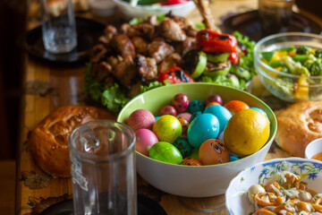 Obraz na płótnie Canvas Easter dinner on the table, painted eggs