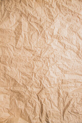 Crumpled beige paper detailed texture. Copy space, top view