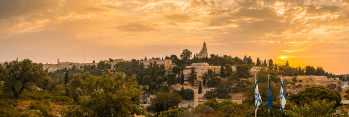 Beautiful sunrise panorama of Mount Zion: Dormition Abbey, Jerusalem university college and greek...