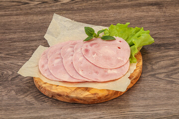Slised ham snack over board