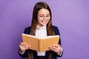 Close-up portrait of her she lovely focused brainy long-haired pre-teen girl schoolchild reading home task homework diary isolated bright vivid shine vibrant lilac violet color background