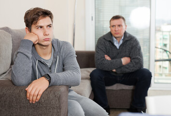 Teenager son quarreled with her father. High quality photo