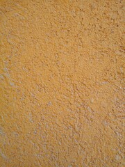 Background from an orange wall of sandstone close-up.