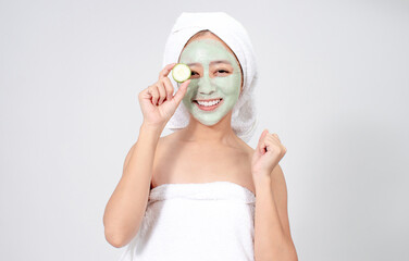 Asian woman is facial mask and holds a crack. She is happy and surprise.