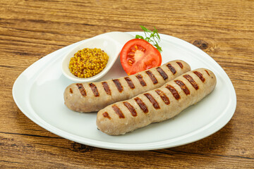 Grilled natural pork sausages with sauce