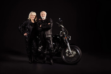 Obraz na płótnie Canvas Portrait of his he her she nice attractive funky content cheerful cheery grey-haired couple chopper travelers club lifestyle freedom lovers folded arms isolated over black color background