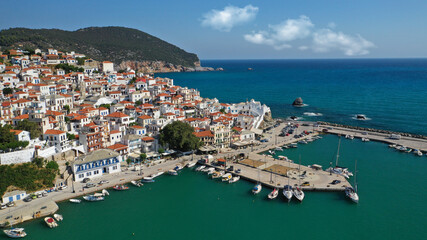 Aerial drone photo of beautiful main town and port of Skopelos island featuring landmark church of...