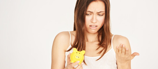 pretty girl with yellow piggy bank. Save mony concept. Moneybox financial investment. Woman...