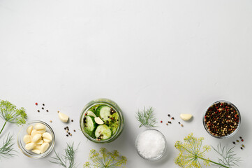 Healthy probiotic vegan food. Homemade fermented cucumbers with garlic, dill and pepper in a glass...