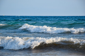 Beautiful day at the beach with sea waves
