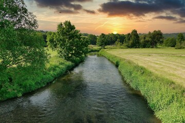 Fototapeta premium sunset over river