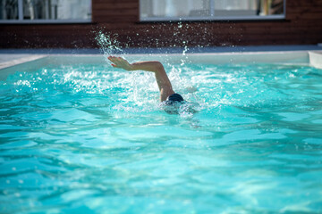 Swimmer swimming in the pool head underwater