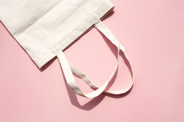 Linen natural grocery bag on a pink background. Zero waste