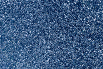 Fototapeta na wymiar Asphalt road surface Dark blue asphalt background Dark asphalt surface Dark blue asphalt surface Asphalt pavement surface with small stones