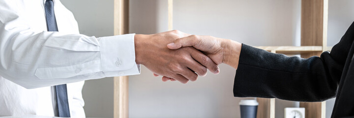 Fototapeta na wymiar Male candidate shaking hands with Interviewer or employer after a job interview