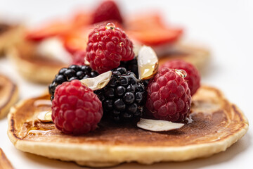 
Tasty breakfast. Pancake with raspberries and blackberries. Close-up.