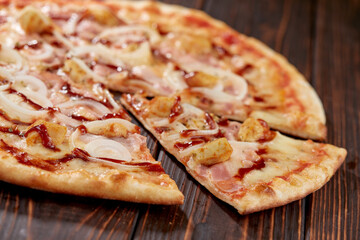 tasty pizza on the wooden background