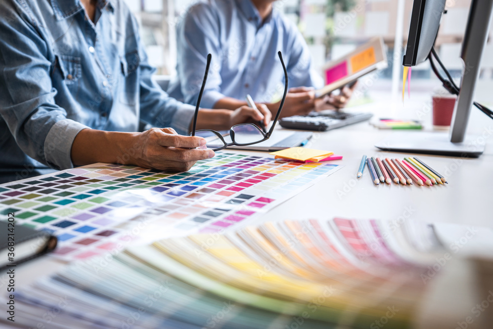 Poster two creative graphic designer working on color selection and color swatches
