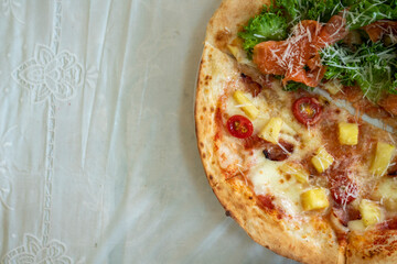 Pizza in front of Salmon Hawaiian's hand-made shop.