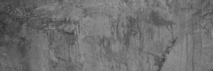 Texture of a old grungy gray concrete wall with cracks as a background or wallpaper